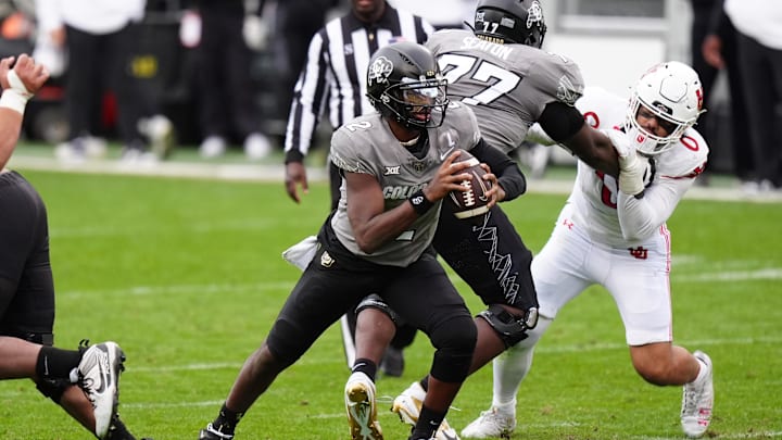 Nov 16, 2024; Boulder, Colorado, USA; Colorado Buffaloes quarterback Shedeur Sanders (2) carries the ball in the second half against the Utah Utes at Folsom Field.  