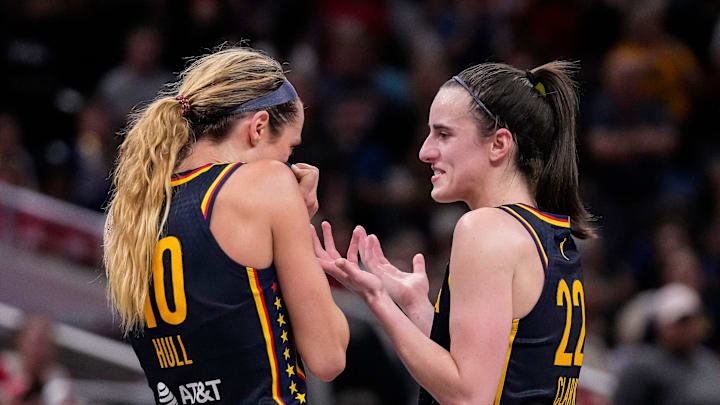 Indiana Fever guard Caitlin Clark (22) and Indiana Fever guard Lexie Hull (10) talk during a timeout on Sunday, Sept. 15, 2024, during the game at Gainbridge Fieldhouse in Indianapolis. The Indiana Fever defeated the Dallas Wings, 110-109.