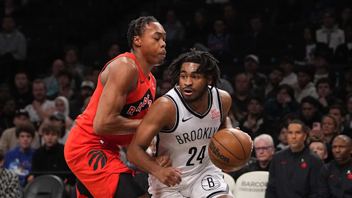 Oct 18, 2024; Brooklyn, New York, USA; Brooklyn Nets small guard Cam Thomas (24) dribbles the ball against Toronto Raptors small forward Scottie Barnes (4) during the first half at Barclays Center. Mandatory Credit: Gregory Fisher-Imagn Images