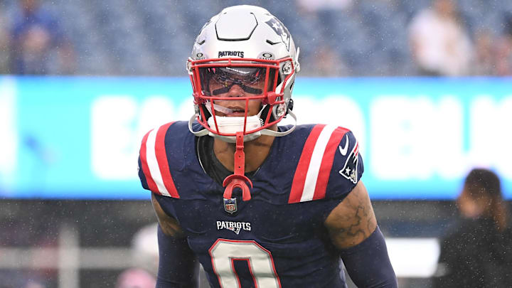 August 8, 2024; Foxborough, MA, USA;  New England Patriots cornerback Christian Gonzalez (0) warms up before a game against the Carolina Panthers at Gillette Stadium. Mandatory Credit: Eric Canha-Imagn Images