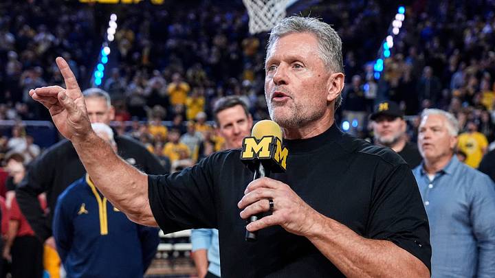Michigan football head coach Kyle Whittingham speaks as he is being introduced on the floor during the first half between Michigan and USC at Crisler Center in Ann Arbor on Friday, Jan. 2, 2026.