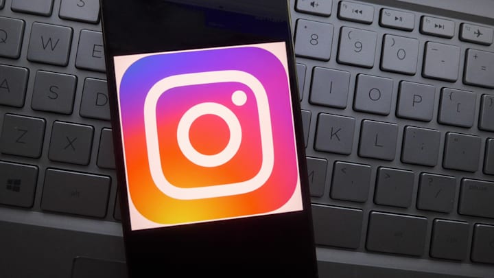 In this photo illustration, Instagram logo is displayed on a...