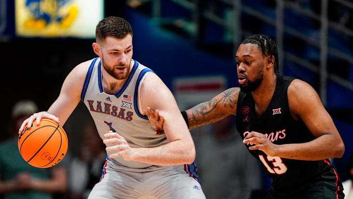 Feb 3, 2024; Lawrence, Kansas, USA; Kansas Jayhawks center Hunter Dickinson (1) dribbles the ball
