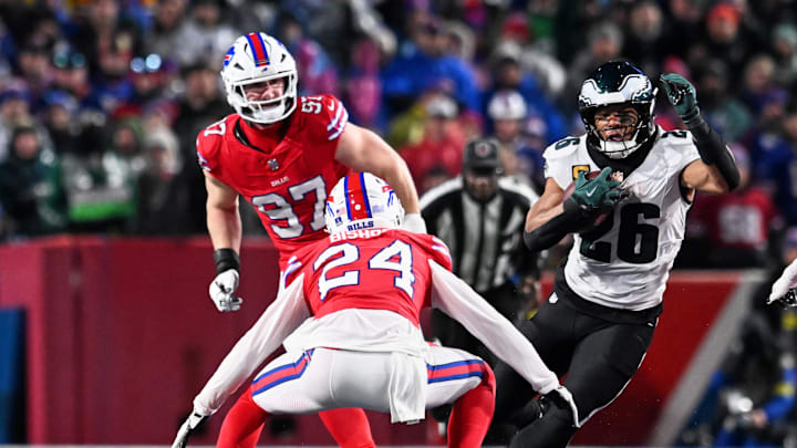 Dec 28, 2025; Orchard Park, New York, USA; Philadelphia Eagles running back Saquon Barkley (26) runs the ball against Buffalo Bills safety Cole Bishop (24) and defensive end Joey Bosa (97) during the second quarter at Highmark Stadium. Mandatory Credit: Mark Konezny-Imagn Images Dec 28, 2025; Orchard Park, New York, USA; Philadelphia Eagles running back Saquon Barkley (26) runs the ball against Buffalo Bills safety Cole Bishop (24) and defensive end Joey Bosa (97) during the second quarter at Highmark Stadium. Mandatory Credit: Mark Konezny-Imagn Images