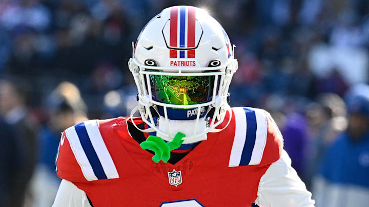 Dec 1, 2024; Foxborough, Massachusetts, USA; New England Patriots cornerback Christian Gonzalez (0) warms up before a game against the Indianapolis Colts at Gillette Stadium. Mandatory Credit: Eric Canha-Imagn Images