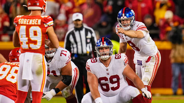 Nov 1, 2021; Kansas City, Missouri, USA; New York Giants quarterback Daniel Jones (8) and center Billy Price (69) check the defense before the snap against the Kansas City Chiefs during the second half at GEHA Field at Arrowhead Stadium. Mandatory Credit: Jay Biggerstaff-Imagn Images