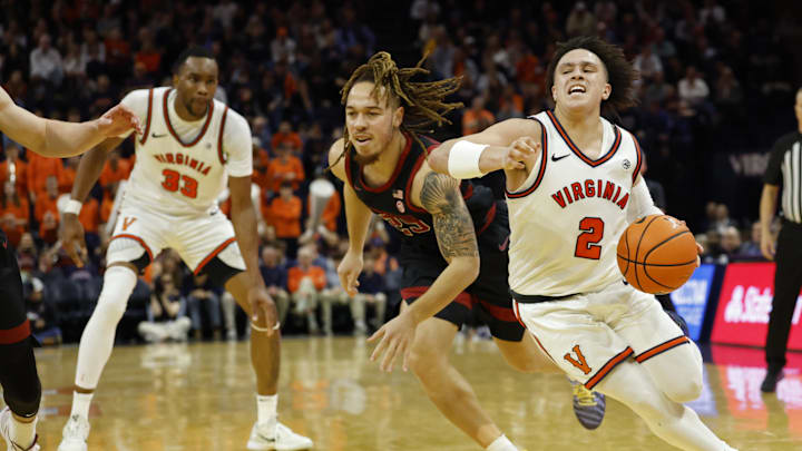Jan 10, 2026; Charlottesville, Virginia, USA; Virginia Cavaliers guard Chance Mallory (2) drives to the basket past Stanford Cardinal guard Jeremy Dent-Smith (25) in the second half at John Paul Jones Arena. Mandatory Credit: Geoff Burke-Imagn Images