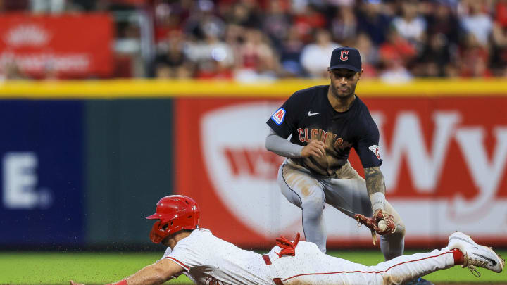 Jun 12, 2024; Cincinnati, Ohio, USA; Cincinnati Reds first baseman Spencer Steer (7) steals second against Cleveland Guardians shortstop Brayan Rocchio (4) in the sixth inning at Great American Ball Park. Mandatory Credit: Katie Stratman-USA TODAY Sports