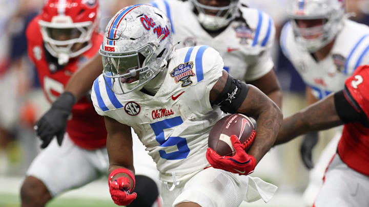 Jan 1, 2026; New Orleans, LA, USA; Mississippi Rebels running back Kewan Lacy (5) carries the ball against the Georgia Bulldogs in the first quarter during the 2025 Sugar Bowl and quarterfinal game of the College Football Playoff at Caesars Superdome. Mandatory Credit: Stephen Lew-Imagn Images