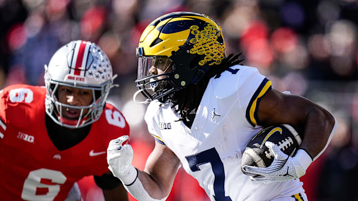 Michigan running back Donovan Edwards (7) runs against Ohio State during the first half at Ohio Stadium in Columbus, Ohio on Saturday, Nov. 30, 2024.
