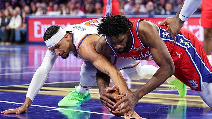 Oct 30, 2026; Philadelphia, Pennsylvania, USA; Philadelphia 76ers center Joel Embiid (21) and New York Knicks guard Josh Hart (3) go for a loose ball during the second quarter at Xfinity Mobile Arena. Mandatory Credit: Bill Streicher-Imagn Images