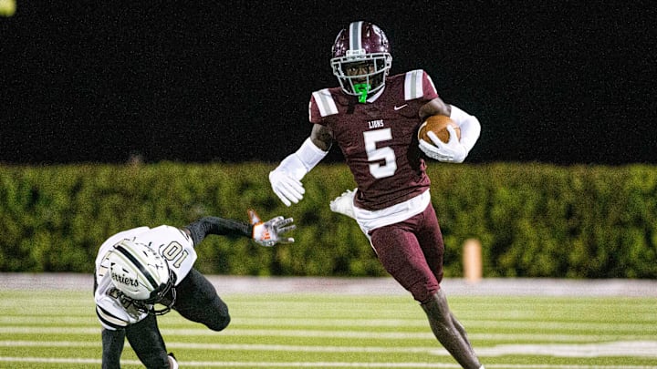 Winston Watkins from FBA gains yards against Moore Haven during the Class 1S-Region 4 championship