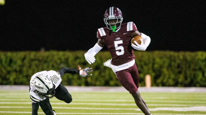 Winston Watkins from FBA gains yards against Moore Haven during the Class 1S-Region 4 championship at FBA Friday, Nov. 24, 2023. FBA leads 20-0 at half