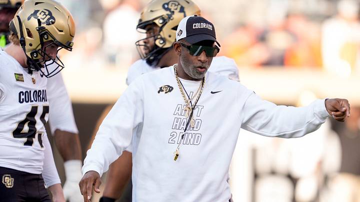 Colorado coach Deion Sanders stands on the field as the team warms up before a college football game between the Oklahoma State Cowboys (OSU) and the Colorado Buffaloes at Boone Pickens Stadium in Stillwater, Okla., Saturday, Oct. 24, 2026. Colorado coach Deion Sanders stands on the field as the team warms up before a college football game between the Oklahoma State Cowboys (OSU) and the Colorado Buffaloes at Boone Pickens Stadium in Stillwater, Okla., Saturday, Oct. 24, 2026.