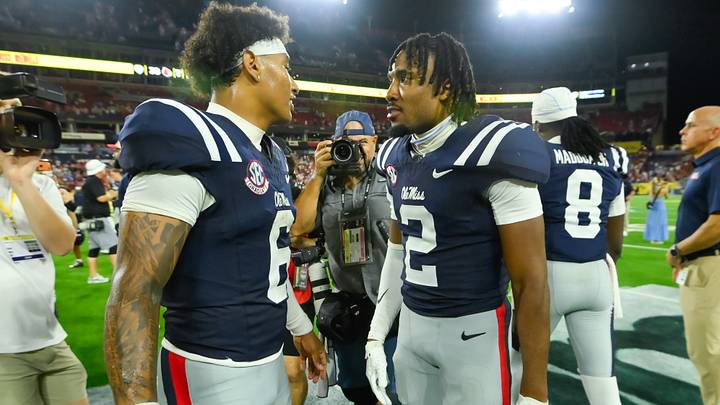 Ole Miss Rebels quarterback Trinidad Chambliss and quarterback Deuce Knight talk against the Louisville Cardinals during the second half at Nissan Stadium. Mandatory Credit: Steve Roberts-Imagn Images Ole Miss Rebels quarterback Trinidad Chambliss and quarterback Deuce Knight talk against the Louisville Cardinals during the second half at Nissan Stadium. Mandatory Credit: Steve Roberts-Imagn Images