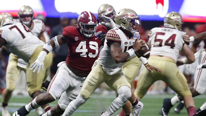 Sep 2, 2017; Atlanta, GA, USA; Alabama Crimson Tide defensive lineman Isaiah Buggs (49) pressures Florida State Seminoles quarterback Deondre Francois (12) in the third quarter at Mercedes-Benz Stadium. Mandatory Credit: Brett Davis-Imagn Images