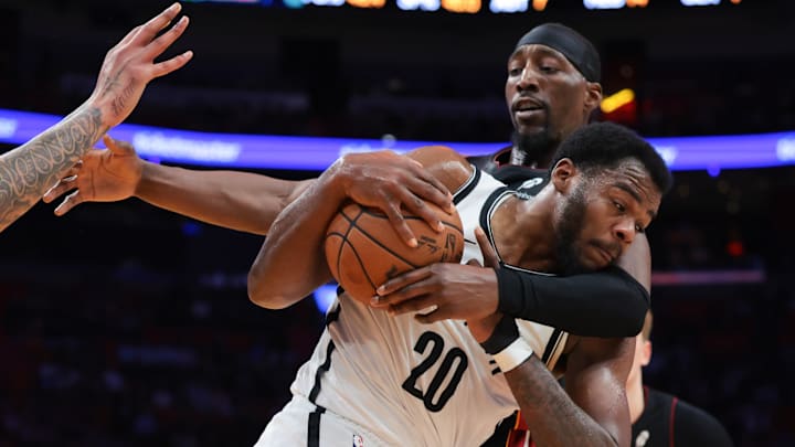 Mar 3, 2026; Miami, Florida, USA; Brooklyn Nets center Day'ron Sharpe (20) protects the basketball against Miami Heat center Bam Adebayo (13) during the second quarter at Kaseya Center. Mandatory Credit: Sam Navarro-Imagn Images Mar 3, 2026; Miami, Florida, USA; Brooklyn Nets center Day'ron Sharpe (20) protects the basketball against Miami Heat center Bam Adebayo (13) during the second quarter at Kaseya Center. Mandatory Credit: Sam Navarro-Imagn Images
