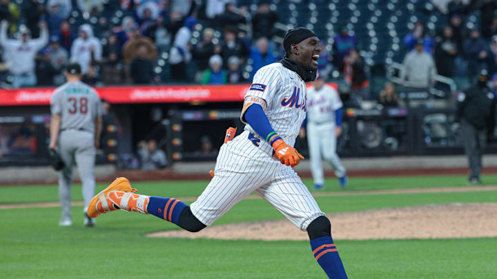Apr 7, 2026; New York City, New York, USA;  New York Mets pinch hitter Ronny Mauricio (0) celebrates after hitting an RBI walk-off single during the tenth inning against the Arizona Diamondbacks at Citi Field. Mandatory Credit: Vincent Carchietta-Imagn Images