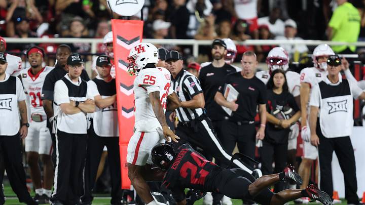 Sep 18, 2026; Lubbock, Texas, USA; Texas Tech Red Raiders defensive safety Malik Esquerra (24) tackles Houston Cougars running back DJ Butler (25) in the second half at Galaxy Stadium. Mandatory Credit: Michael C. Johnson-Imagn Images Sep 18, 2026; Lubbock, Texas, USA; Texas Tech Red Raiders defensive safety Malik Esquerra (24) tackles Houston Cougars running back DJ Butler (25) in the second half at Galaxy Stadium. Mandatory Credit: Michael C. Johnson-Imagn Images