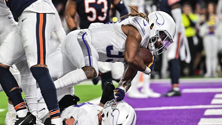 Dec 16, 2024; Minneapolis, Minnesota, USA; Minnesota Vikings running back Aaron Jones (33) leaps for a touchdown run during the third quarter against the Chicago Bears at U.S. Bank Stadium. Mandatory Credit: Jeffrey Becker-Imagn Images Dec 16, 2024; Minneapolis, Minnesota, USA; Minnesota Vikings running back Aaron Jones (33) leaps for a touchdown run during the third quarter against the Chicago Bears at U.S. Bank Stadium. Mandatory Credit: Jeffrey Becker-Imagn Images