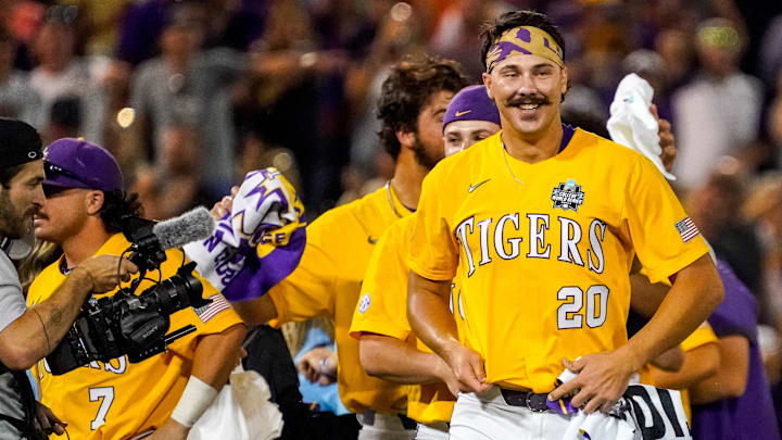 Jun 26, 2023; Omaha, NE, USA; LSU Tigers pitcher Paul Skenes (20) smiles after winning the College World Series over the Florida Gators at Charles Schwab Field Omaha. Mandatory Credit: Dylan Widger-Imagn Images