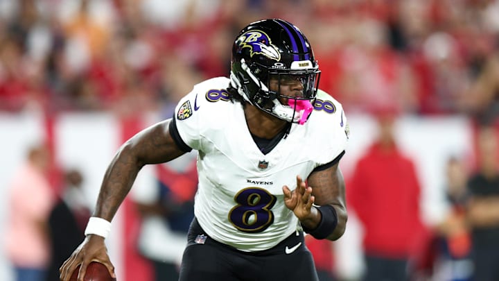 Oct 21, 2024; Tampa, Florida, USA; Baltimore Ravens quarterback Lamar Jackson (8) drops back to pass against the Tampa Bay Buccaneers in the second quarter at Raymond James Stadium. Mandatory Credit: Nathan Ray Seebeck-Imagn Images