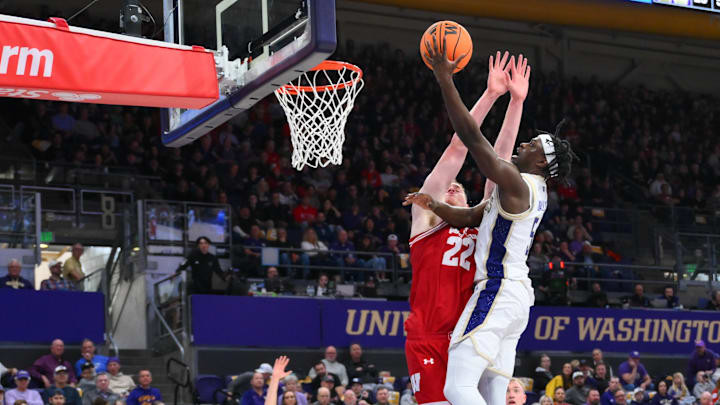 Feb 28, 2026; Seattle, Washington, USA; Washington Huskies guard Zoom Diallo (5) shoots the ball over Wisconsin Badgers forward Austin Rapp (22) during the first half at Alaska Airlines Arena at Hec Edmundson Pavilion. 