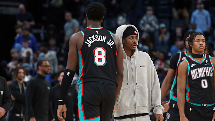 Jan 9, 2026; Memphis, Tennessee, USA; Memphis Grizzlies guard Ja Morant (right) reacts with Memphis Grizzlies forward/center Jaren Jackson Jr. (8) after the game against the Oklahoma City Thunder at FedExForum. Mandatory Credit: Petre Thomas-Imagn Images
