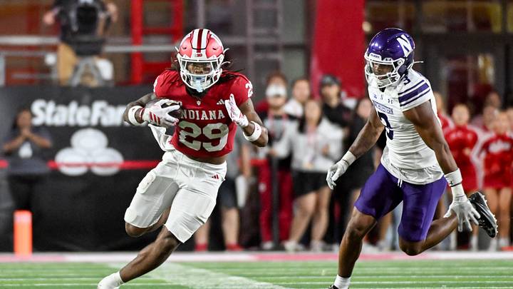 Sep 25, 2026; Bloomington, Indiana, USA; Indiana Hoosiers running back Lee Beebe Jr. (29) runs the ball past Northwestern Wildcats defensive back Brenden Deasfernandes (3) during the first half at Merchants Bank Field at Memorial Stadium. Mandatory Credit: Robert Goddin-Imagn Images