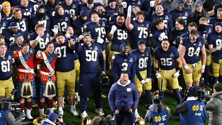 Dec 20, 2024; Notre Dame, Indiana, USA; Notre Dame Fighting Irish head coach Marcus Freeman celebrates with his team after defeating the Indiana Hoosiers in the first round of the College Football Playoff at Notre Dame Stadium. Mandatory Credit: Matt Cashore-Imagn Images