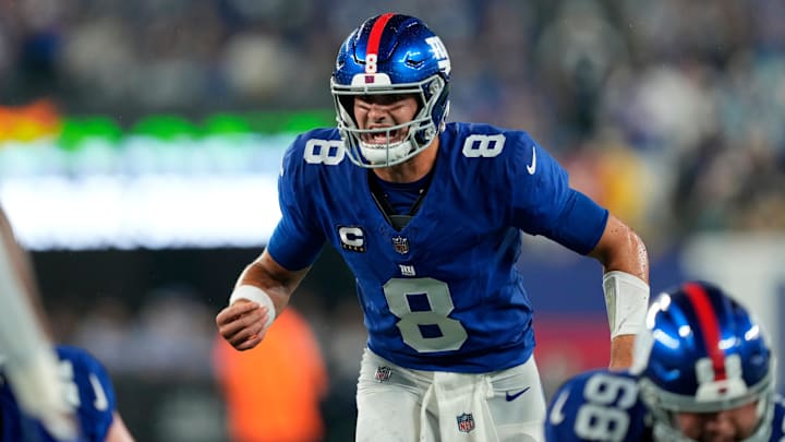 New York Giants quarterback Daniel Jones (8) had a difficult time handling the wet ball and the