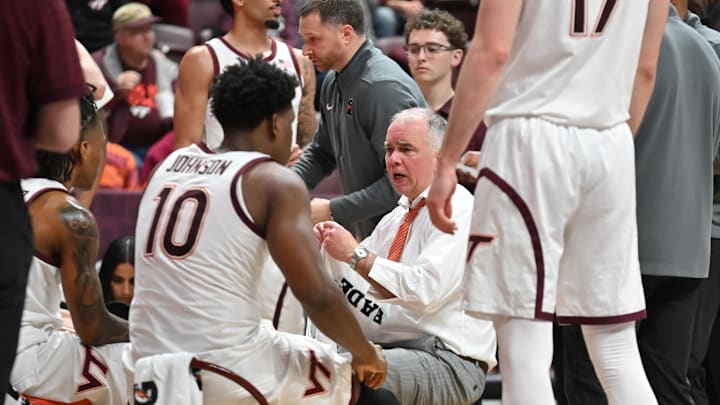 Mar 3, 2026; Blacksburg, Virginia, USA;  Virginia Tech Hokies head coach Mike Young talks to his team during a time out during the second half at Cassell Coliseum. Mandatory Credit: Brian Bishop-Imagn Images