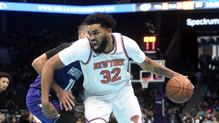 Nov 29, 2024; Charlotte, North Carolina, USA;  New York Knicks center Karl-Anthony Towns (32) drives in during the first half against the Charlotte Hornets at the Spectrum Center. Mandatory Credit: Sam Sharpe-Imagn Images