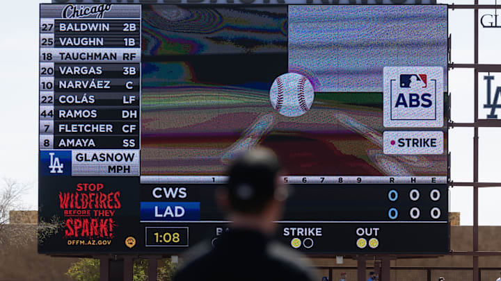 An umpire looks at the Jumbotron during an automated ball-strike challenge aka ABS in the Los Angeles Dodgers game against the Chicago White Sox during spring training at Camelback Ranch-Glendale. 