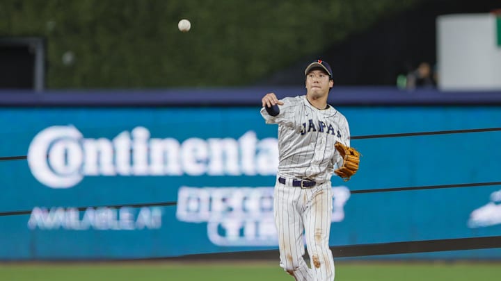 Mar 20, 2023; Miami, Florida, USA; Japan second baseman Tetsuto Yamada (1) throws the baseball to first baseman Kazuma Okamoto (not pictured) to retire Mexico first baseman Joey Meneses (not pictured) during the sixth inning at LoanDepot Park. Mandatory Credit: Sam Navarro-Imagn Images Mar 20, 2023; Miami, Florida, USA; Japan second baseman Tetsuto Yamada (1) throws the baseball to first baseman Kazuma Okamoto (not pictured) to retire Mexico first baseman Joey Meneses (not pictured) during the sixth inning at LoanDepot Park. Mandatory Credit: Sam Navarro-Imagn Images