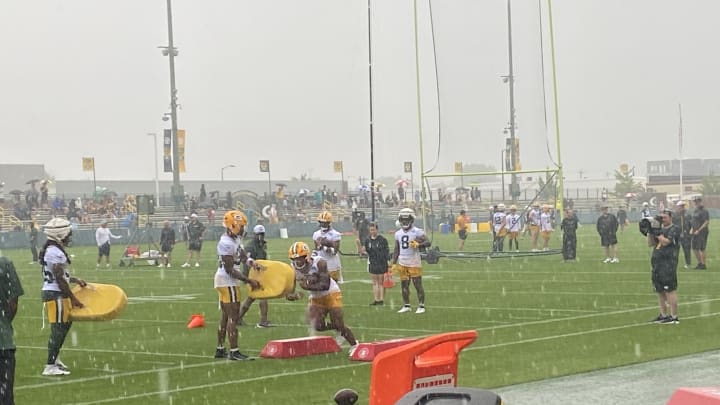 Packers running backs are bringing the intensity during drills amid heavy rain at Ray Nitschke Field. Packers running backs are bringing the intensity during drills amid heavy rain at Ray Nitschke Field.