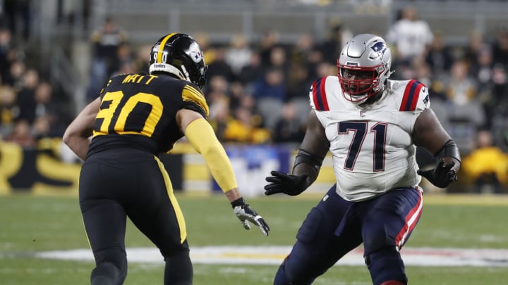 Dec 7, 2023; Pittsburgh, Pennsylvania, USA;  New England Patriots guard Mike Onwenu (71) blocks against Pittsburgh Steelers linebacker T.J. Watt (90) during the second quarter at Acrisure Stadium. Mandatory Credit: Charles LeClaire-USA TODAY Sports