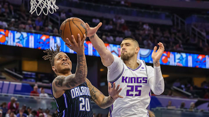Mar 26, 2022; Orlando, Florida, USA; Sacramento Kings center Alex Len (25) blocks a shot by Orlando Magic guard Markelle Fultz (20) during the second half at Amway Center. Mandatory Credit: Mike Watters-Imagn Images