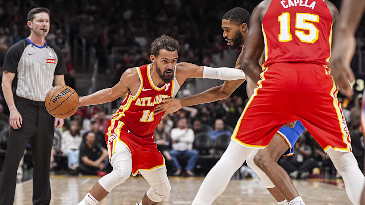 Nov 6, 2024; Atlanta, Georgia, USA; Atlanta Hawks guard Trae Young (11) dribbles against New York Knicks forward Mikal Bridges (25) during the second half at State Farm Arena. Mandatory Credit: Dale Zanine-Imagn Images
