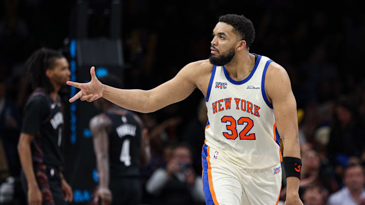 Mar 20, 2026; Brooklyn, New York, USA; New York Knicks center Karl-Anthony Towns (32) reacts after scoring a basket against the Brooklyn Nets during the second half at Barclays Center. Mandatory Credit: Vincent Carchietta-Imagn Images