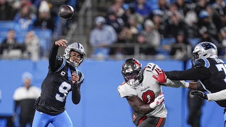 Dec 1, 2024; Charlotte, North Carolina, USA; Carolina Panthers quarterback Bryce Young (9) throws under pressure from Tampa Bay Buccaneers linebacker Yaya Diaby (0) during the second quarter at Bank of America Stadium. Mandatory Credit: Jim Dedmon-Imagn Images