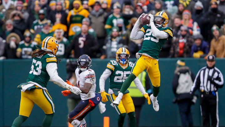 Green Bay Packers safety Xavier McKinney (29) soars high to intercept a pass against the Chicago Bears. Green Bay Packers safety Xavier McKinney (29) soars high to intercept a pass against the Chicago Bears.