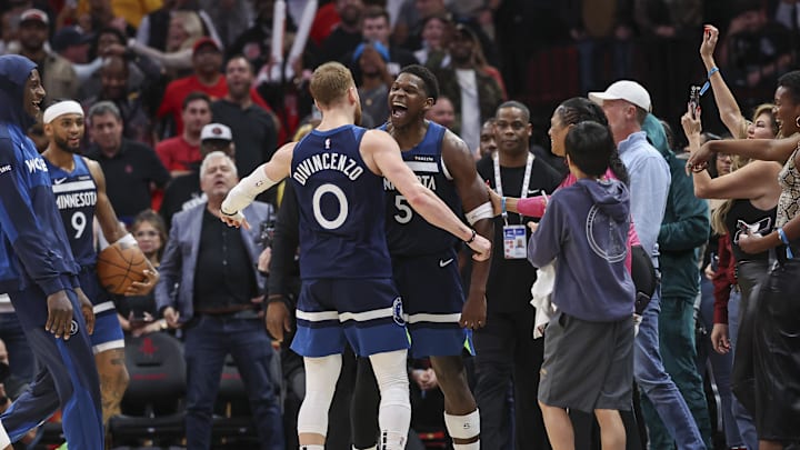 Dec 27, 2024; Houston, Texas, USA; Minnesota Timberwolves guard Anthony Edwards (5) celebrates with guard Donte DiVincenzo (0) after the Timberwolves defeated the Houston Rockets at Toyota Center. Mandatory Credit: Troy Taormina-Imagn Images