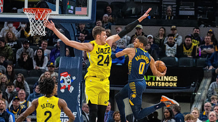 Feb 13, 2023; Indianapolis, Indiana, USA; Indiana Pacers guard Tyrese Haliburton (0) passes the ball while Utah Jazz center Walker Kessler (24) defends in the second quarter at Gainbridge Fieldhouse. Mandatory Credit: Trevor Ruszkowski-Imagn Images Feb 13, 2023; Indianapolis, Indiana, USA; Indiana Pacers guard Tyrese Haliburton (0) passes the ball while Utah Jazz center Walker Kessler (24) defends in the second quarter at Gainbridge Fieldhouse. Mandatory Credit: Trevor Ruszkowski-Imagn Images