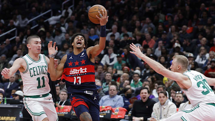 Nov 22, 2024; Washington, District of Columbia, USA; Washington Wizards guard Jordan Poole (13) drives to the basket as Boston Celtics forward Sam Hauser (30) and Celtics guard Payton Pritchard (11) defend in the second half at Capital One Arena. Mandatory Credit: Geoff Burke-Imagn Images Nov 22, 2024; Washington, District of Columbia, USA; Washington Wizards guard Jordan Poole (13) drives to the basket as Boston Celtics forward Sam Hauser (30) and Celtics guard Payton Pritchard (11) defend in the second half at Capital One Arena. Mandatory Credit: Geoff Burke-Imagn Images