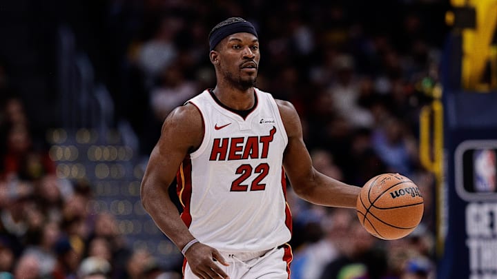 Miami Heat forward Jimmy Butler (22) dribbles the ball up court.