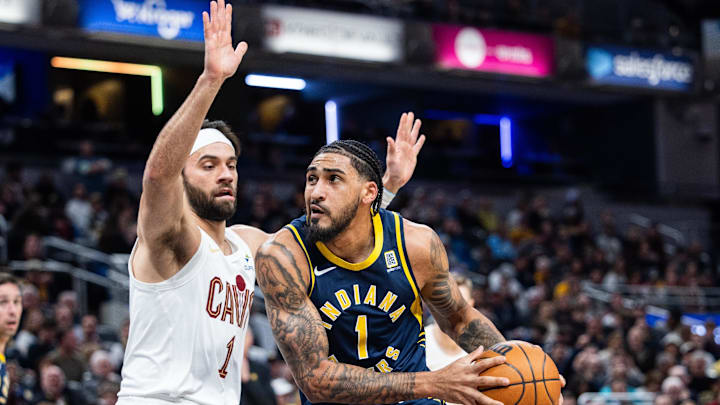 Jan 14, 2025; Indianapolis, Indiana, USA; Indiana Pacers forward Obi Toppin (1) shoots the ball while Cleveland Cavaliers guard Max Strus (1) defends in the second half at Gainbridge Fieldhouse. Mandatory Credit: Trevor Ruszkowski-Imagn Images