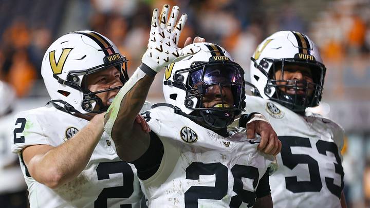 Nov 29, 2025; Knoxville, Tennessee, USA; Vanderbilt Commodores quarterback Diego Pavia (2), running back Sedrick Alexander (28) and offensive lineman Jordan White (53) celebrate a touchdown against the Tennessee Volunteers during the second half at Neyland Stadium. Mandatory Credit: Randy Sartin-Imagn Images Nov 29, 2025; Knoxville, Tennessee, USA; Vanderbilt Commodores quarterback Diego Pavia (2), running back Sedrick Alexander (28) and offensive lineman Jordan White (53) celebrate a touchdown against the Tennessee Volunteers during the second half at Neyland Stadium. Mandatory Credit: Randy Sartin-Imagn Images