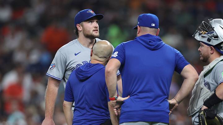 Aug 4, 2026; Houston, Texas, USA; Toronto Blue Jays starting pitcher Trey Yesavage (39) is evaluated by a trainer after an apparent injury during the third inning against the Houston Astros at Daikin Park. Mandatory Credit: Troy Taormina-Imagn Images