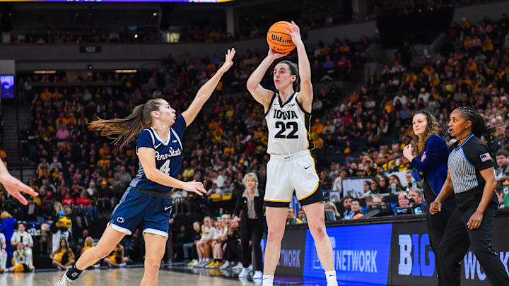 Caitlin Clark (22) shoots over Shay Ciezki during Iowa's 95-62 victory over Penn State in the Big 10 conference tournament